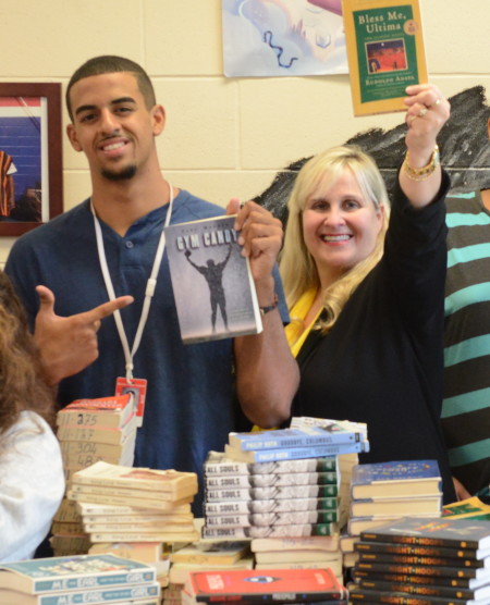 Revere High School English teacher Nancy Barile and Brandon Brito hold up their favorite books. Photo: Richard Howard 