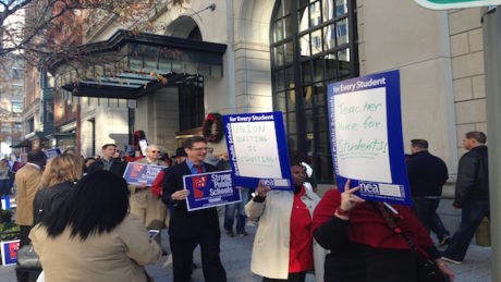 CAVA teachers, joined by NEA members, protest outside a K12 Inc. board meeting in Washington, D.C. last December.